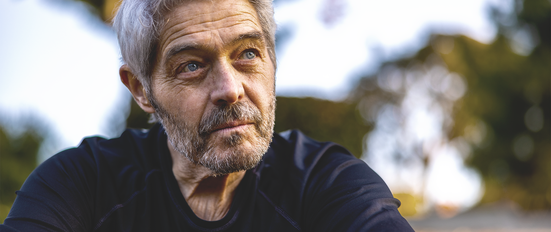 A questioning middle-aged man ponders questions about deep brain stimulation (DBS)