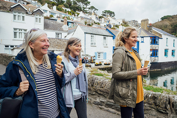 Elder women walking along with icecream