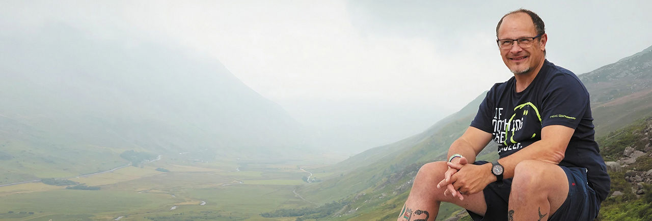 Man sitting in nature talks about the potential of DBS therapy